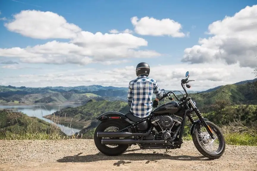 man sitting on motorcycle