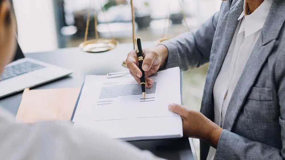 Woman pointing on a document