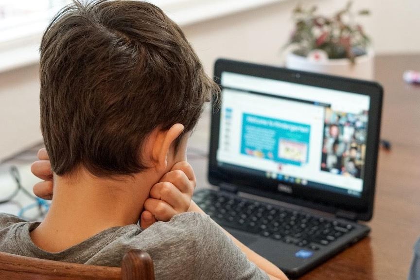 child using laptop on internet