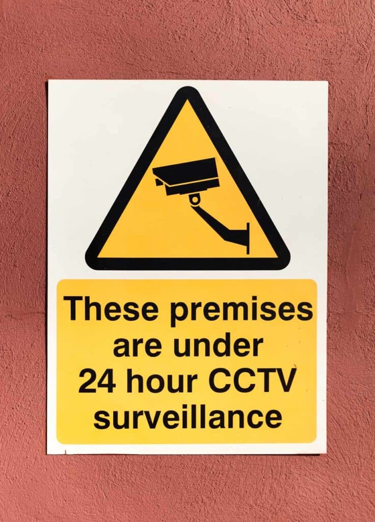 Cctv warning 24 hour surveillance on premises.