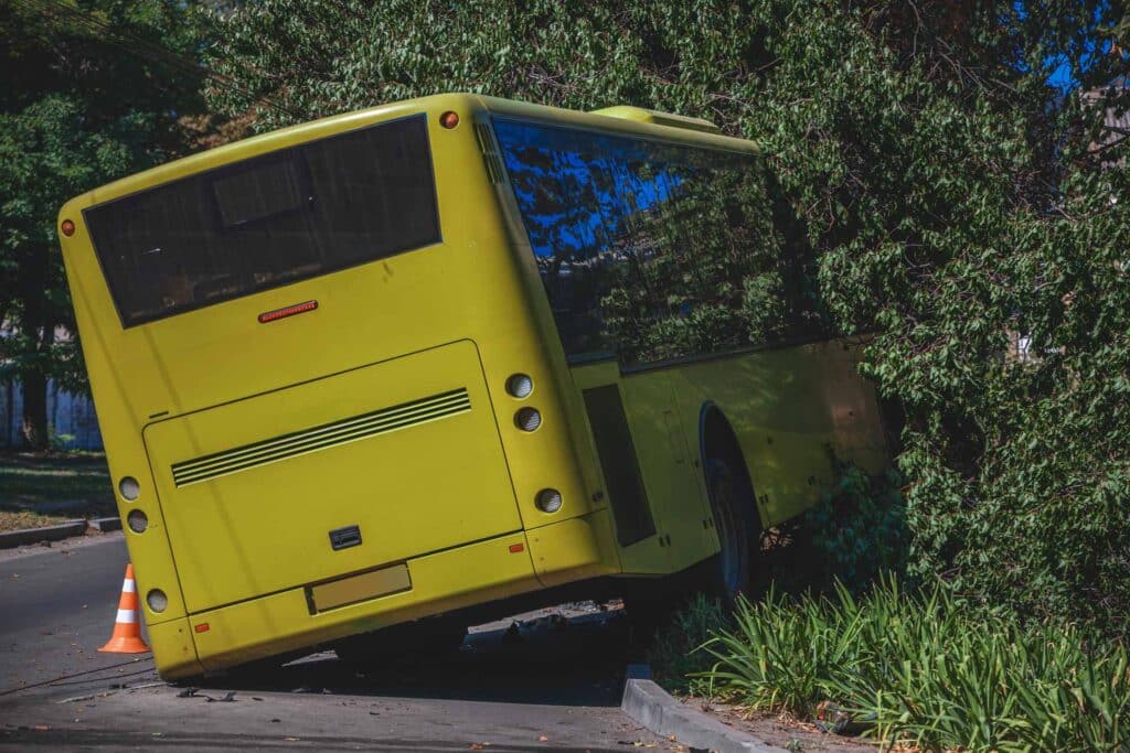 The passenger bus flew off the road and crashed into a tree.