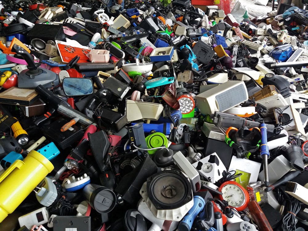 Pile of used electronic and housewares waste division