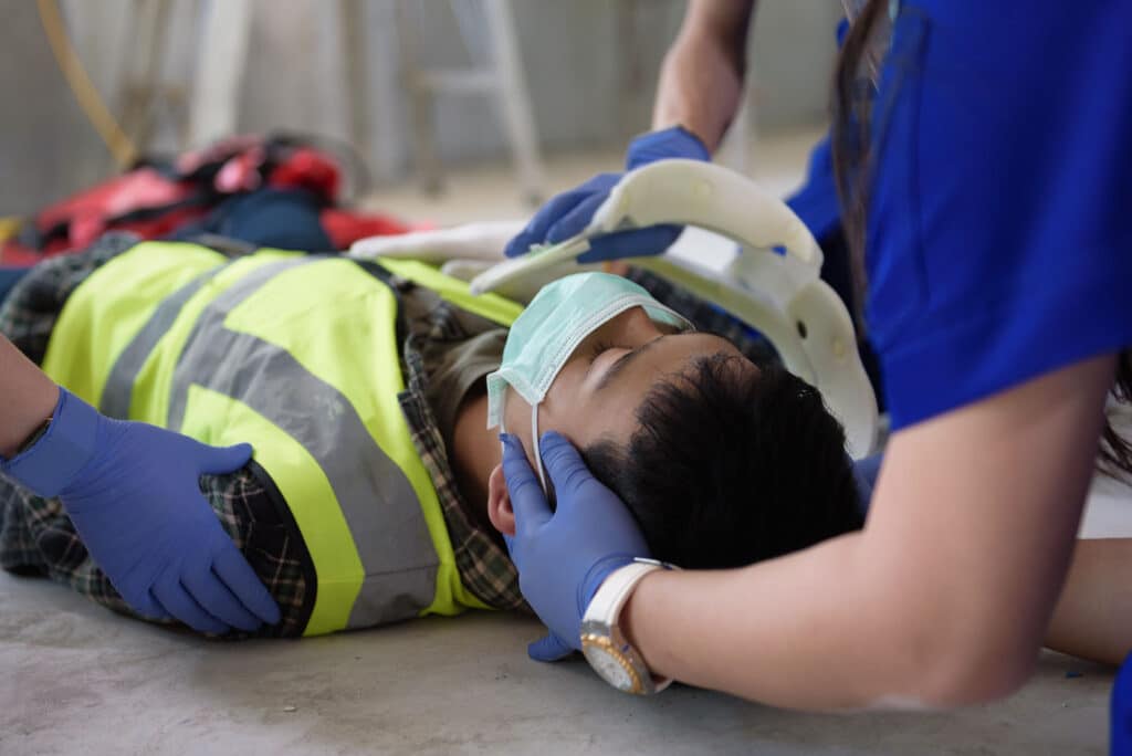 First aid for head injuries and considered for all trauma incidents of worker in work