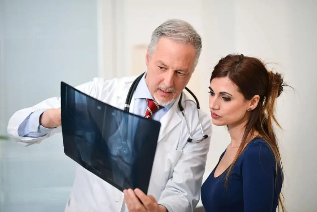 Doctor showing a radiography to his patient