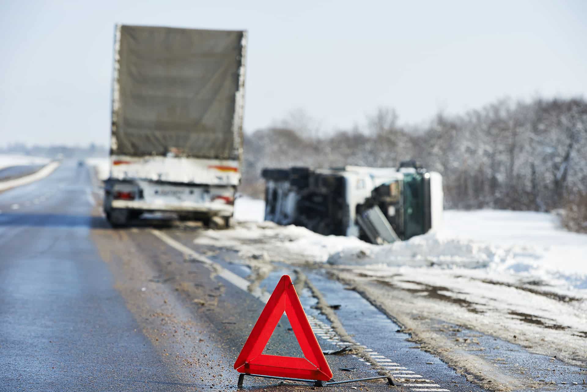 Lorry trailer car crash smash accident on an slippery winter snow interstate road