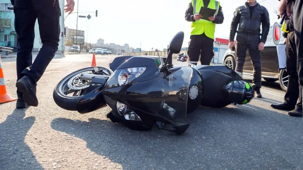 Broken motorcycle on the road accident site