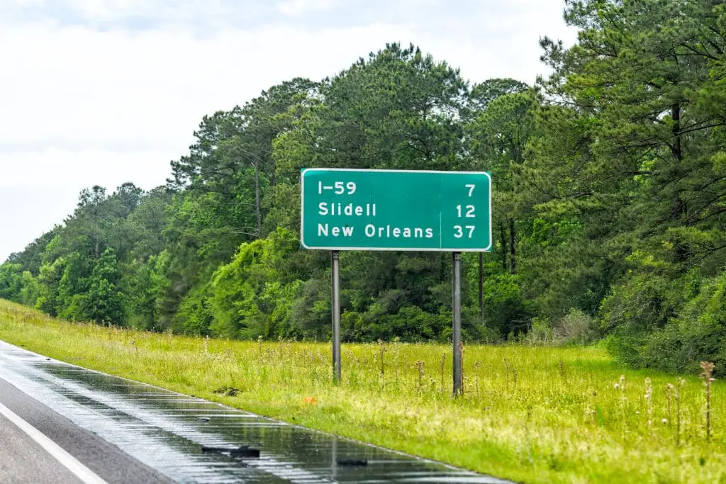 Highway road i10 sign post west interstate 10 with direction sign and text on street for new orleans in lousiana