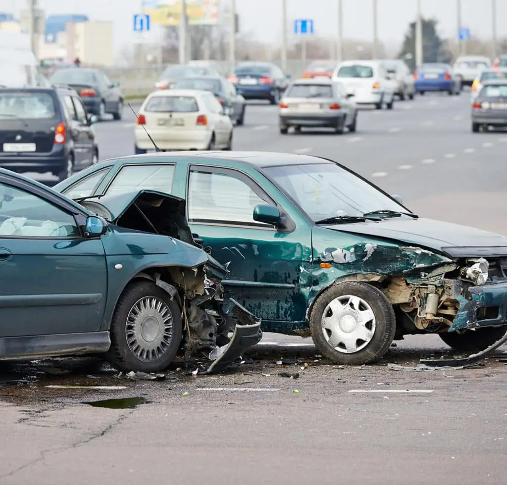 Car crash accident on street, damaged automobiles after collision in city