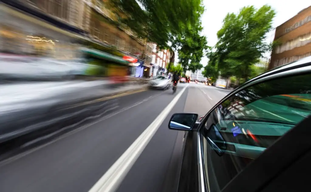 Mirror view of speeding car