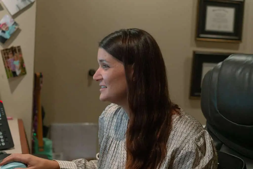 Female lawyer evaluating a texas catastrophic injury case on her computer