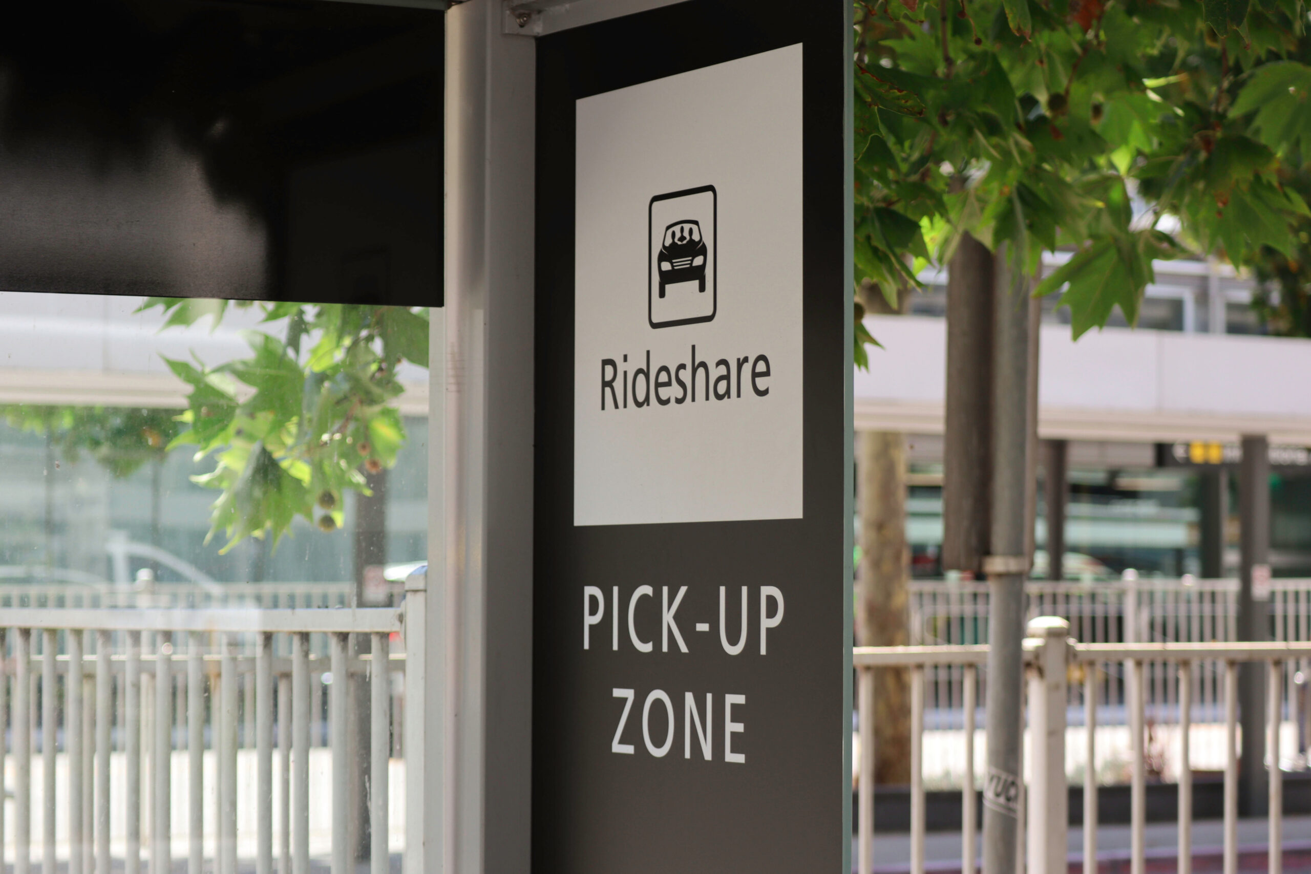 a rideshare pick-up zone sign at a place of business