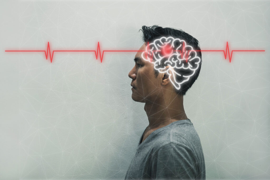 a graphic photo of a man with a highlighted brain and a red line running through it symbolizing nerve damage or issues