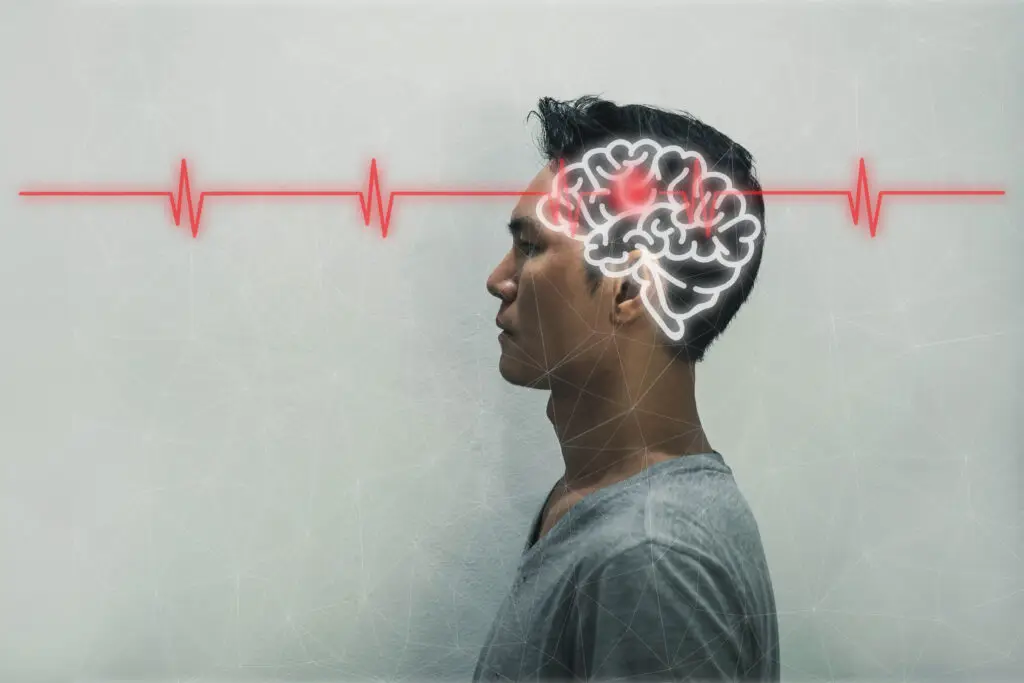 A graphic photo of a man with a highlighted brain and a red line running through it symbolizing nerve damage or issues