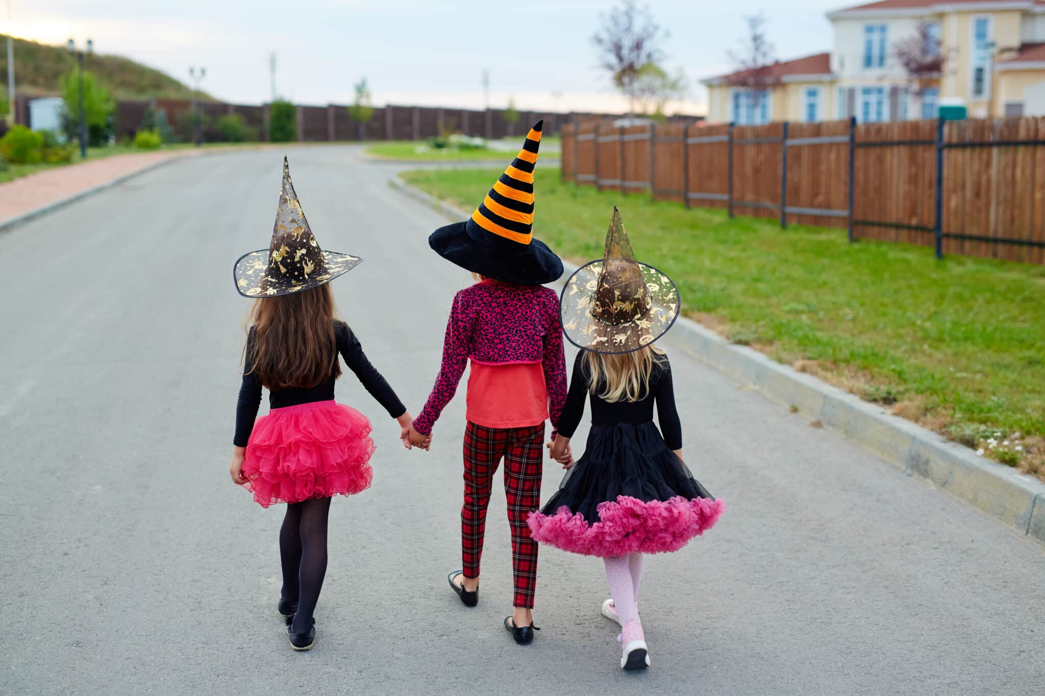 children on a road trick or treating avoiding a pedestrian accident