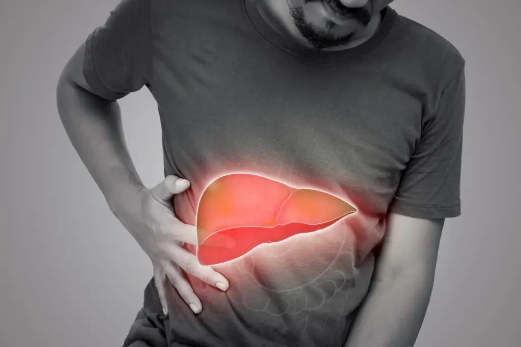 a grayscale photo of a man with a graphic of his liver highlighted to illustrate liver disease or damage