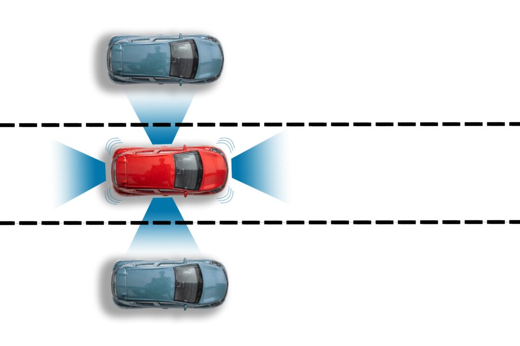 a graphic of a red vehicle using a lane departure system to stay in the proper lane to avoid accidents