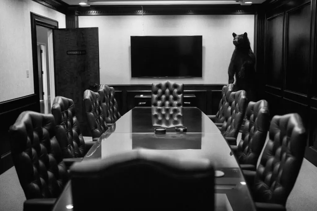 Conference room at an attorney's office with black leather chairs around a large meeting table