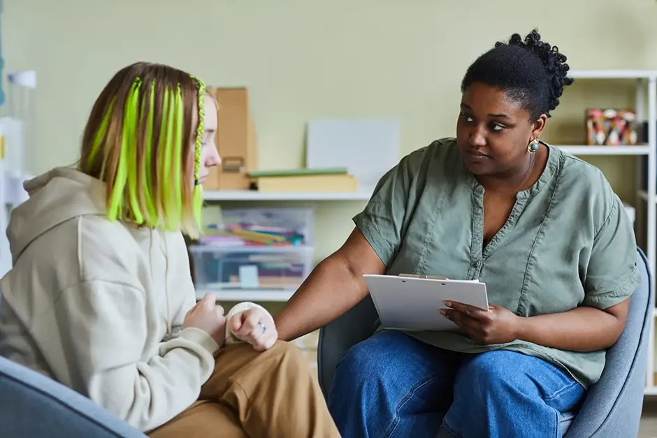 School psychologist supporting a teenage