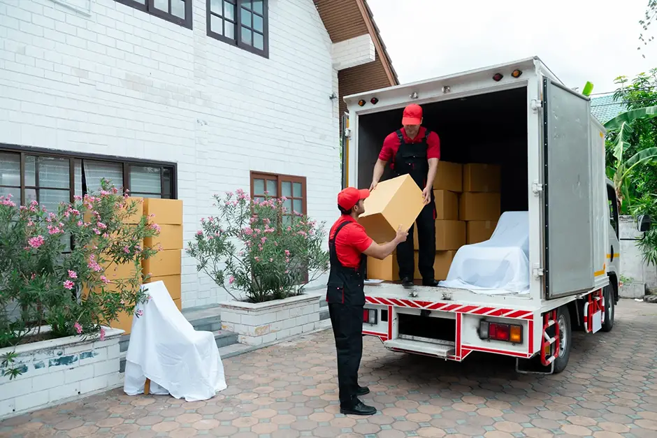 two men stocking a moving van for a family move